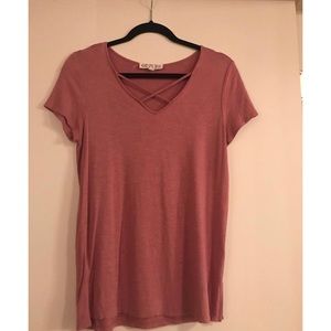 Cross cross neck shirt.